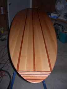 Tail view of wood surfbaord bar top